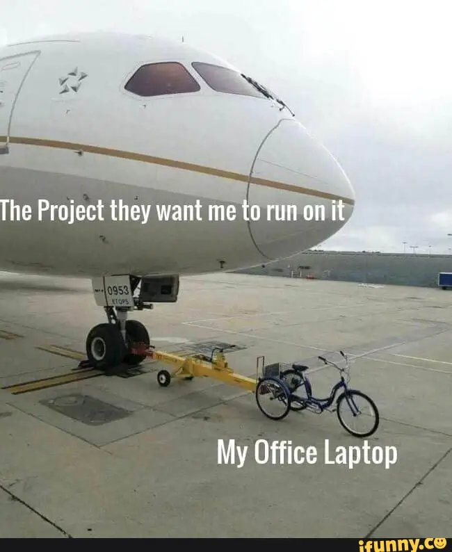 a plane in an airport with a bicycle attached to it at the front